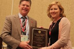 LeeAnn Tomas-Foster, Deputy Director of Environment at the Public Building Commission of Chicago, accepts an award for environmental excellence at the National Association of Environmental Professionals annual awards ceremony. The PBC's environmental program was honored for national excellence.